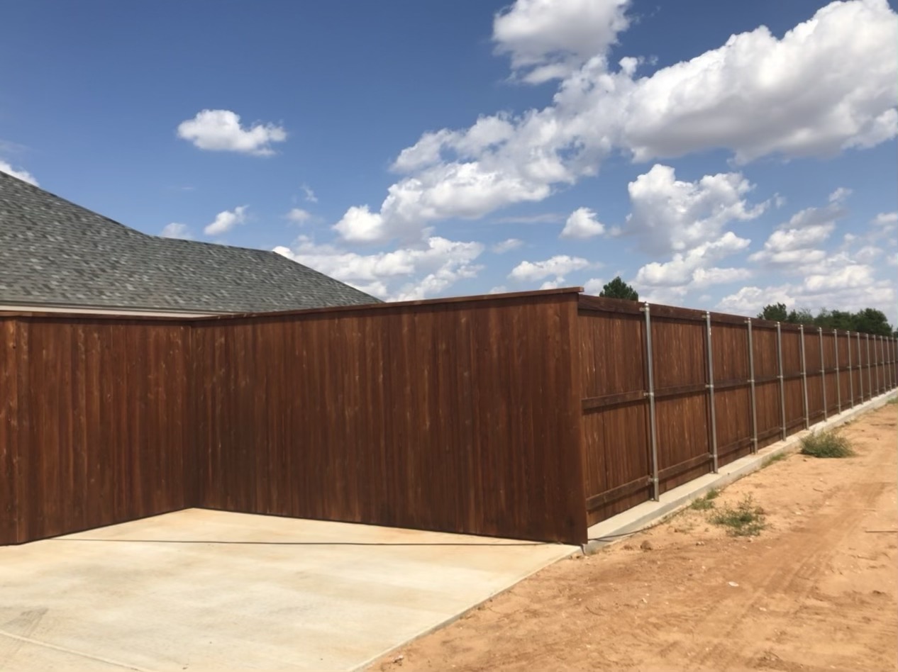 Newly built cedar privacy fence with stained gate