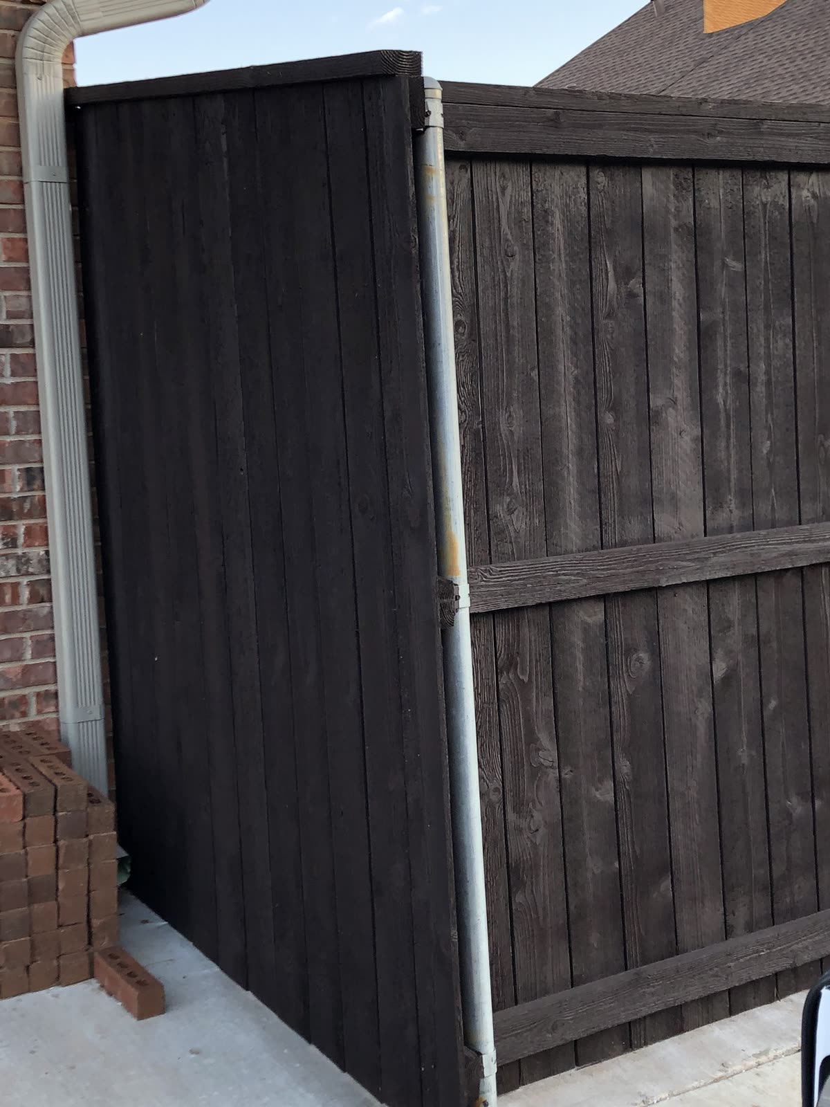 Newly built cedar privacy fence with stained gate